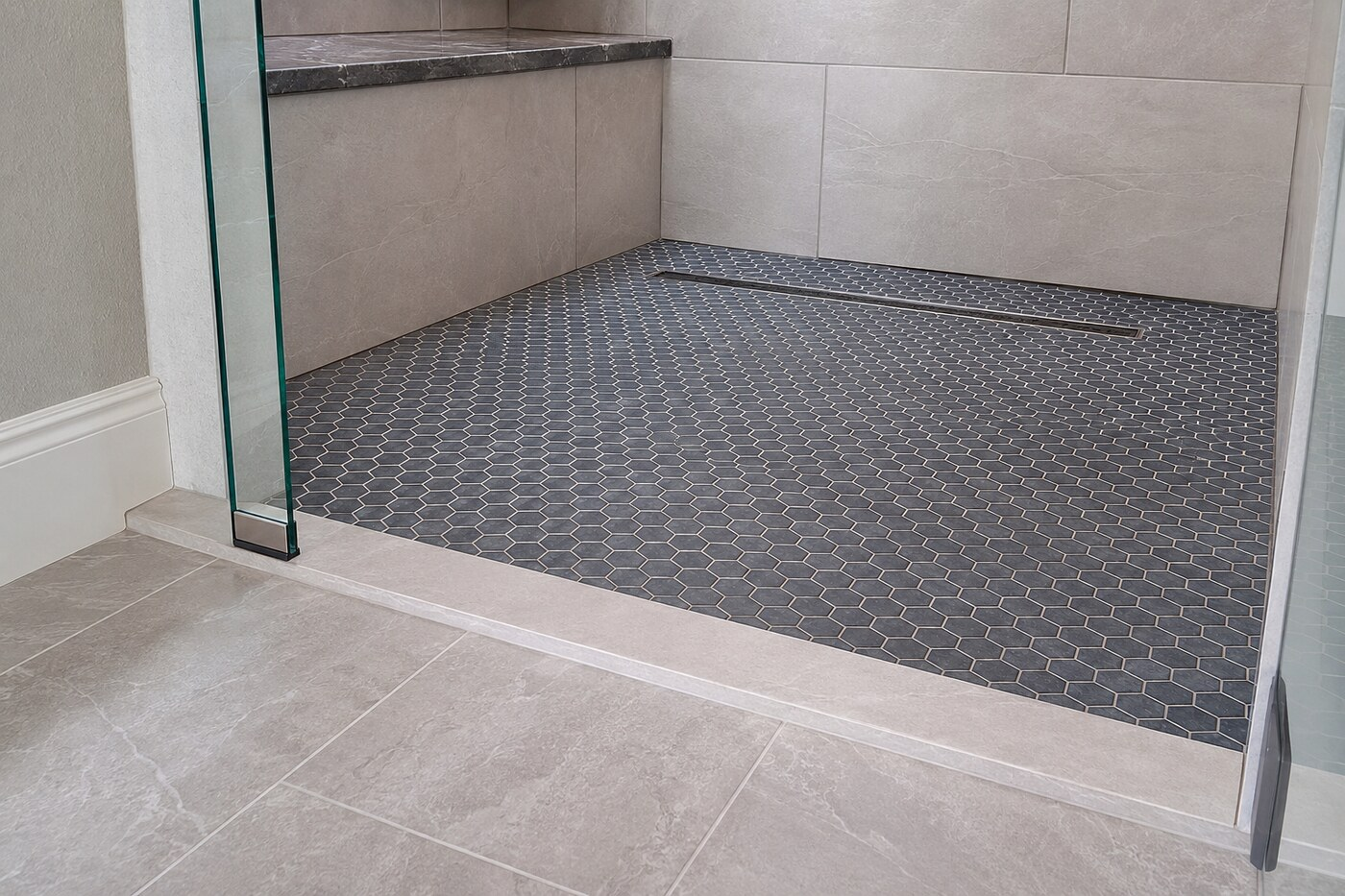 Walk-In Shower Remodeling Denton TX with a low threshold, mosaic floor, bench, and linear drain