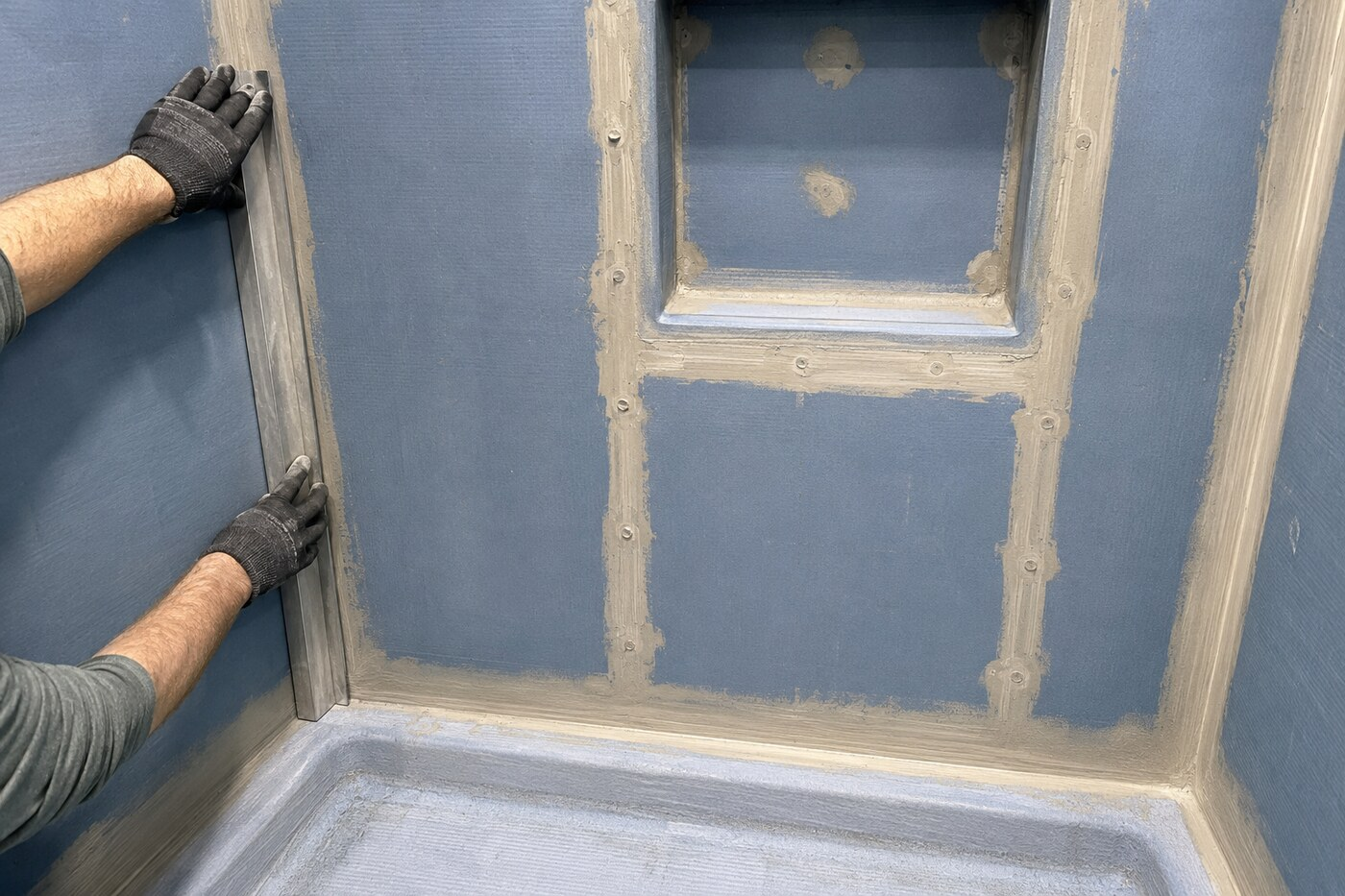 Denton walk-in shower remodel during waterproofing with sealed seams and a recessed niche